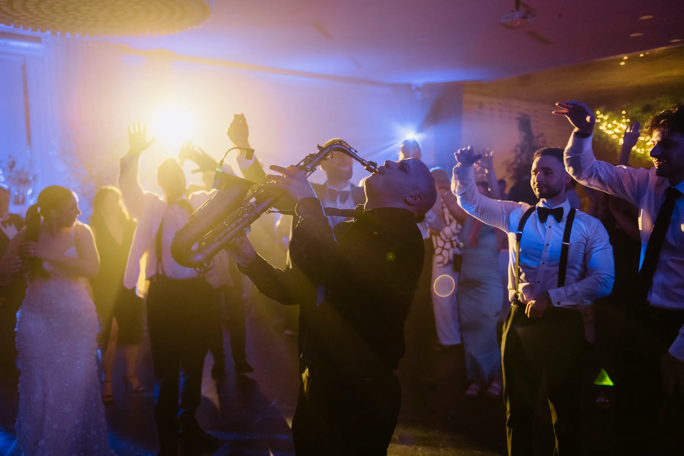 Live saxophone in the middle of the crowd